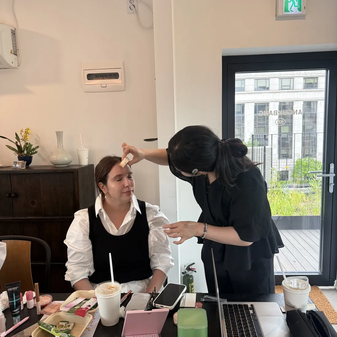 A makeup trial in progress at the table
